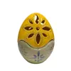 Uovo di Pasqua grande traforato con decorazione gialla e verde e con fiori azzurri (al momento esaurito) - foto 1